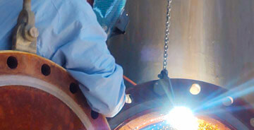 PMI technician providing custom piping services