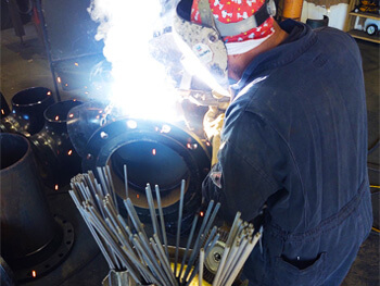 PMI welder performing custom welding services
